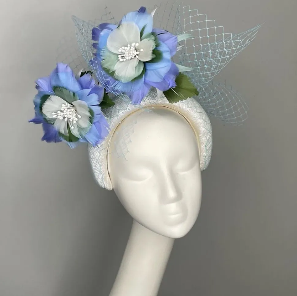 melanie_ferrero__white_he_3.webp Melanie Ferrero - White Headband with Blue Feather Flowers